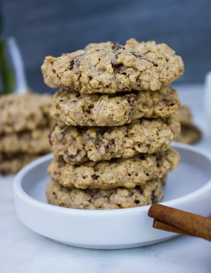 close up stack of healthy oatmeal cookies on a white plate