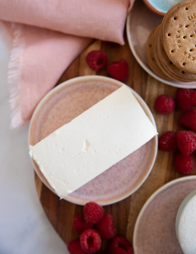 a block of cream cheese on a plate to make the cheese