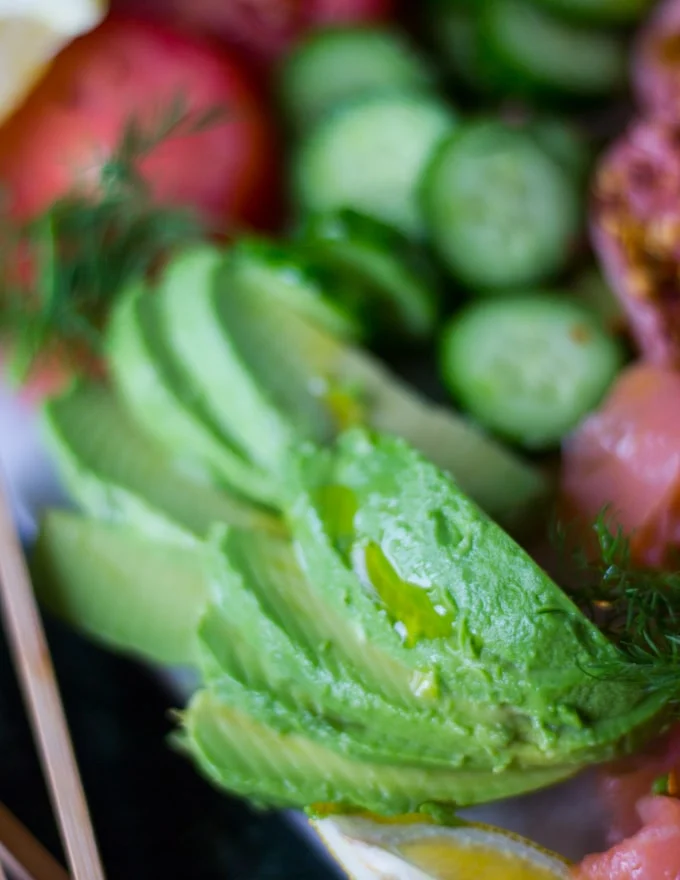 Close up of sliced avocados on the smoked salmon platter
