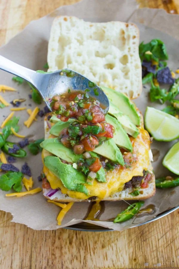A layer of avocados and more salsa over the juicy Burgers for the ultimate fajita toppings