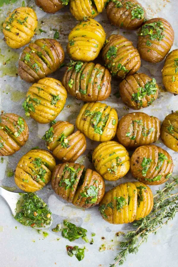 Perfect Roast Potatoes fresh out of the oven served with herb butter
