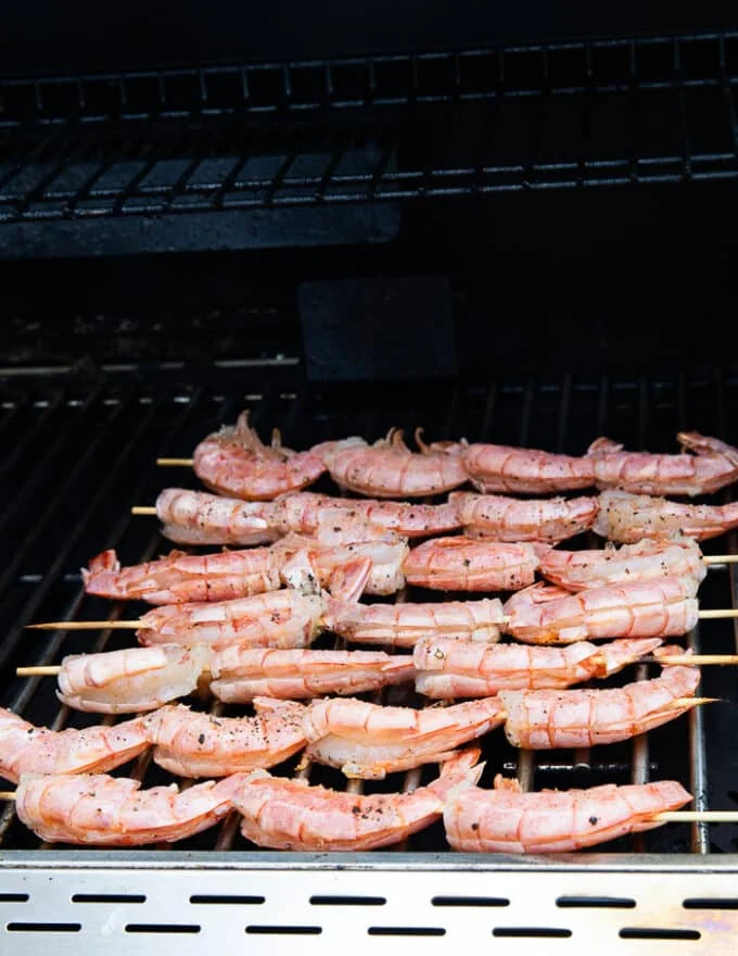 skewers of shrimp on the grill