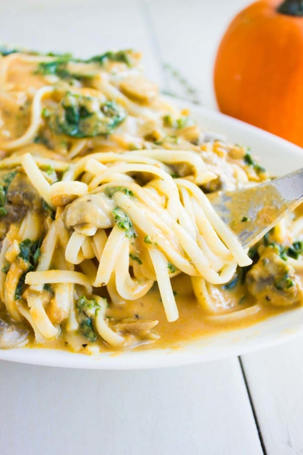 a fork twirling some Kale Mushroom Pumpkin Alfredo Pasta
