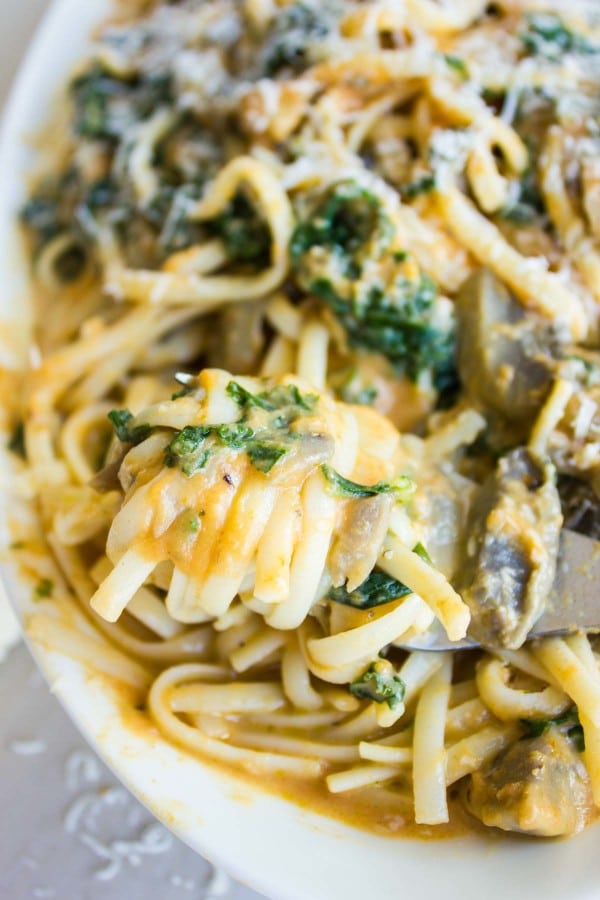 a fork twirling some Kale Mushroom Pumpkin Alfredo Pasta