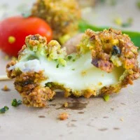 close up of a melted cheese bite from the caprese bites showing the stretchy cheese