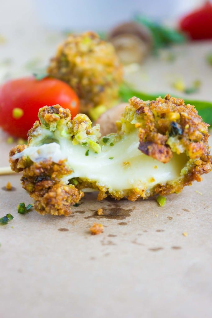 close up of a melted cheese bite from the caprese bites showing the stretchy cheese