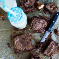 Caramel Stuffed Spiced Brownies. Cayenne spiked fudge-y brownies stuffed with oozing caramel on a baking sheet