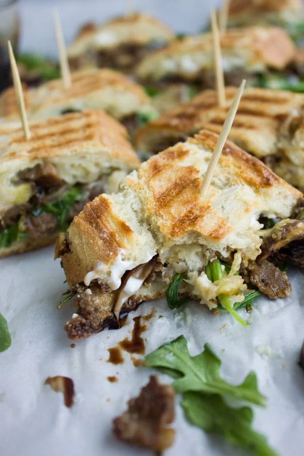 Close-up of sliced of Blue Cheese Philly Steak Sandwich with a bite taken from it