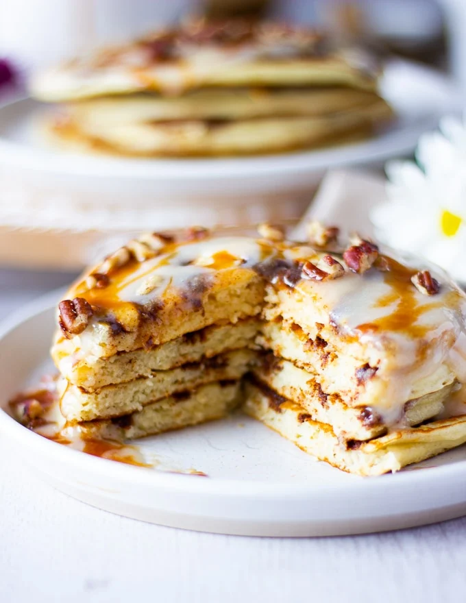 sliced off stack of pancakes showing the texture with a fork