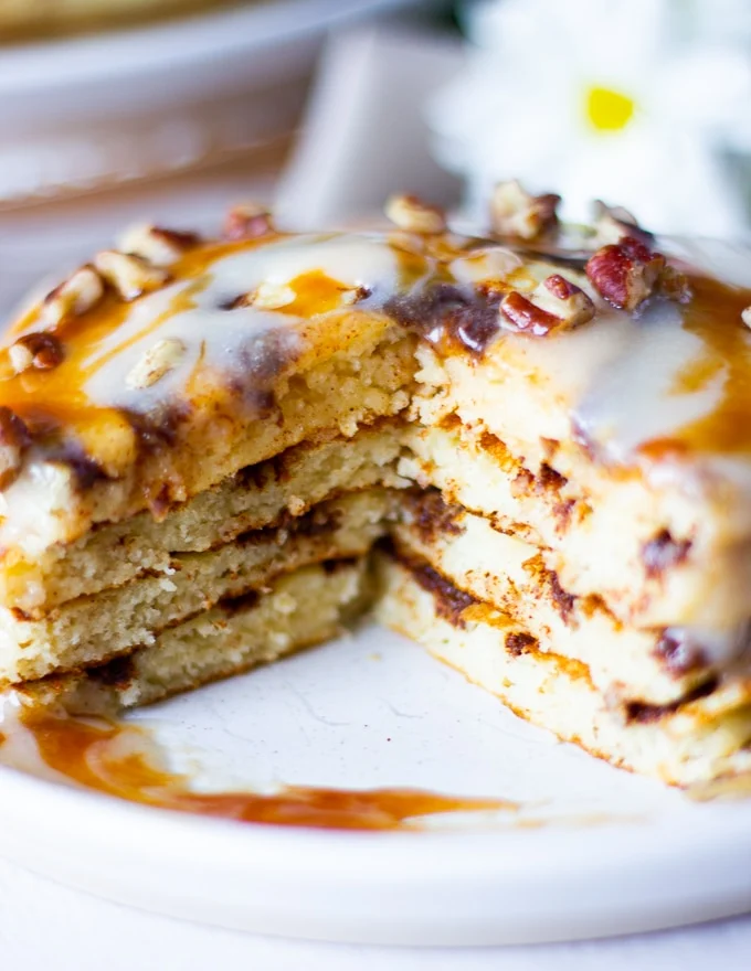 close up of cinnamon roll pancake cut up showing the inside texture