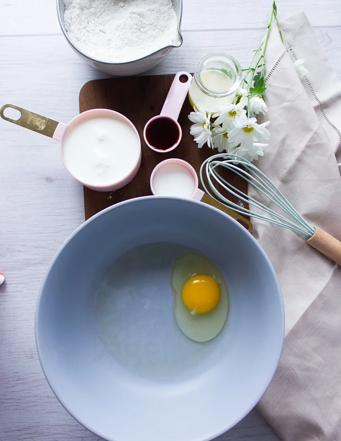Pancake batter ingredients including egg, buttermilk, sugar, vanilla, flour and baking powder