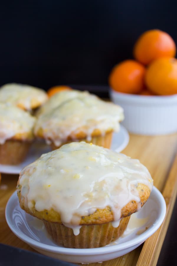 close-up of Ginger Clementine Lemon Poppy Seed Muffin glazed with clementine icing
