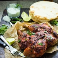 Quick Roast Tandoori Chicken. This absolutely the ONE and only way to make a tandoori chicken without marinating and long hours of waiting! No special ovens needed, just a LOAD of flavors and a secret tip to speed p the roasting! Get this all time favorite recipe and see for yourself! foodallianceblog.com