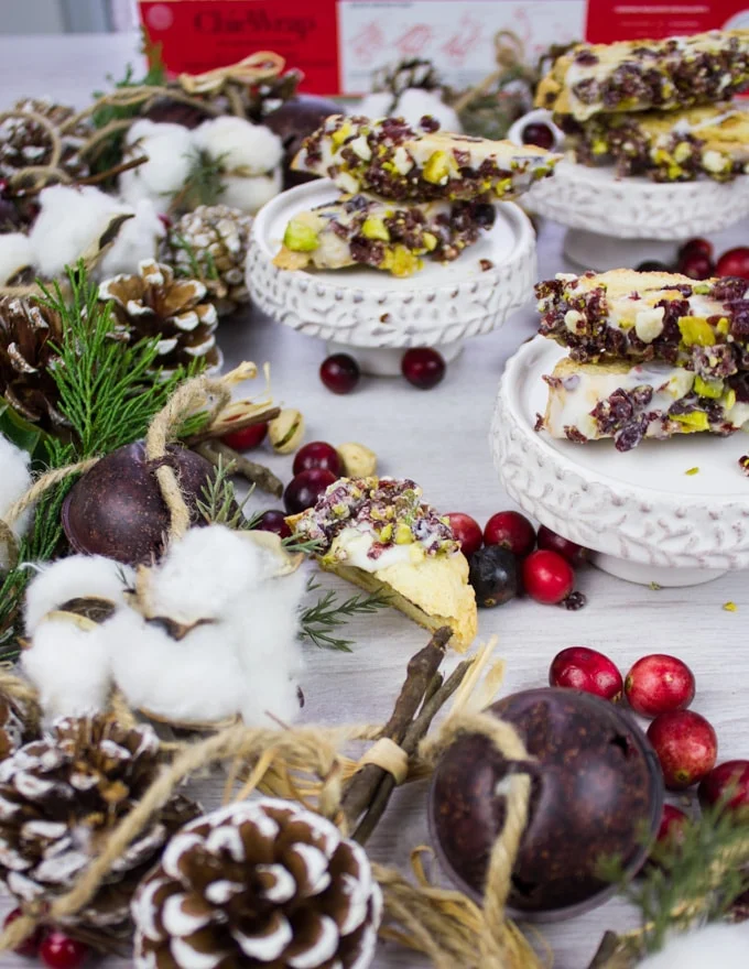 The corner part part of crnaberry pistachio biscotti with scattered cranberries