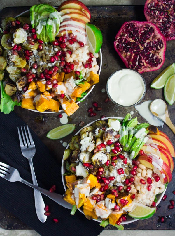 Lentil Fall Harvest Buddha Bowl. This easy, crazy delicious Buddha goodness bowl is all you need to make your life happier! Loaded with greens, lentils, navy beans, apples, avocado, sweet potatoes, sprouts, pomegranate arils--all drizzled with the perfect tahini sauce! Get this recipe and tips for Buddha bowl perfection. foodallianceblog.com