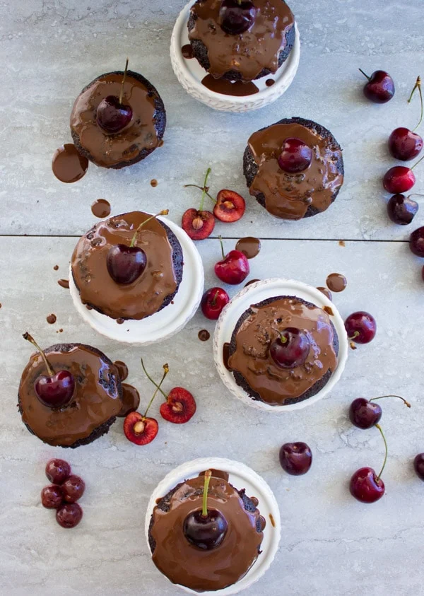 Mini Black Forest Cupcakes topped with chocolate glaze and fresh cherries