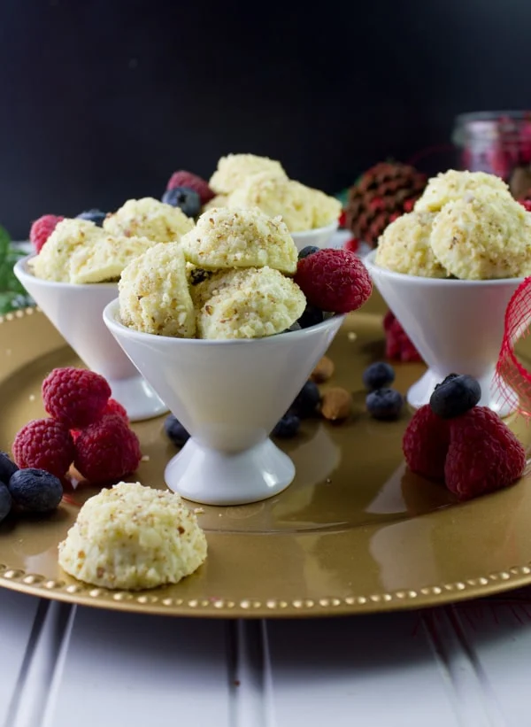 Almond Crunch Greek Yogurt Cheesecake Bites in three white porcelain cups