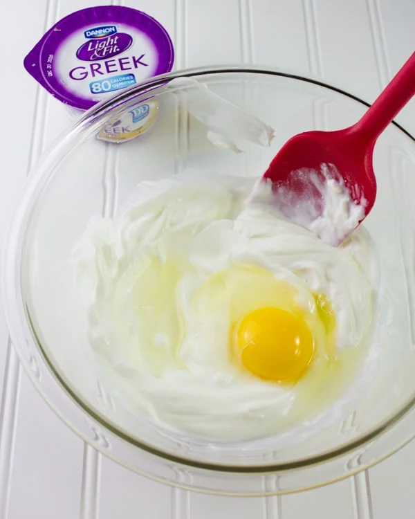 egg and Greek yogurt in a glass bowl