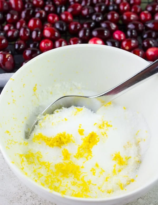 orange zest and sugar mixed in a bowl