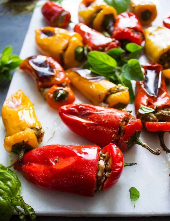 Close up of a stuffed bell pepper on a white marble