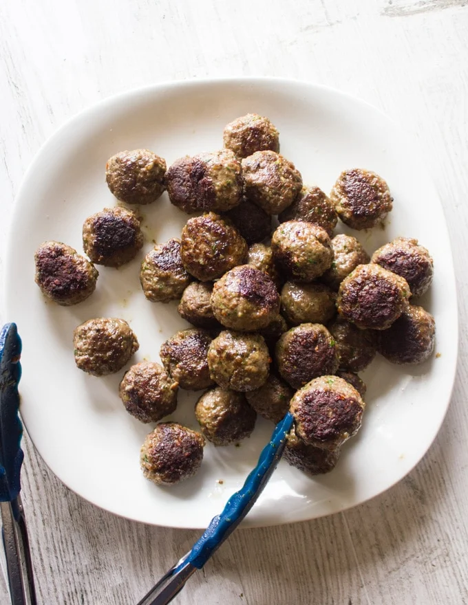 Sauteed and crispy Turkish meatballs removed from the pan and ready for the tomato sauce