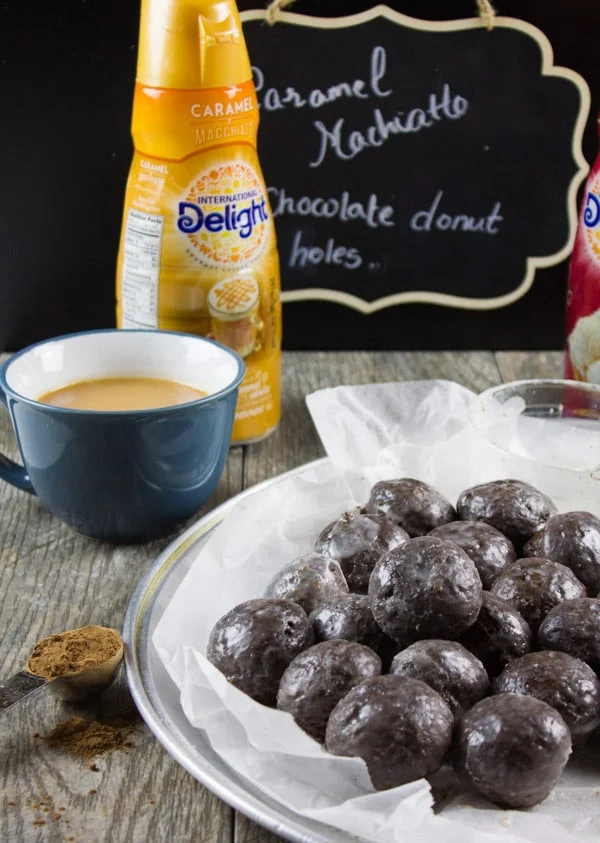 Caramel Spiked Chocolate Donut Holes. The best baked donut holes you'll ever make! tender, fluffy and intensely chocolate-y with a spike of caramel in the donut and glaze! Get the step by step recipe-foodallianceblog.com