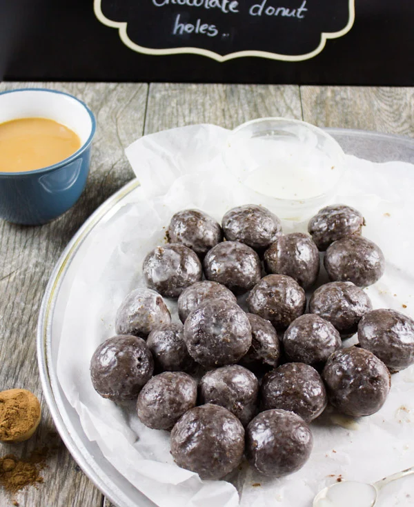 Caramel Spiked Chocolate Donut Holes. The best baked donut holes you'll ever make! tender, fluffy and intensely chocolate-y with a spike of caramel in the donut and glaze! Get the step by step recipe-foodallianceblog.com
