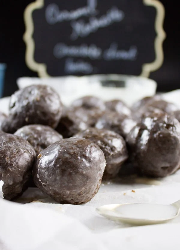 Caramel Spiked Chocolate Donut Holes. The best baked donut holes you'll ever make! tender, fluffy and intensely chocolate-y with a spike of caramel in the donut and glaze! Get the step by step recipe-foodallianceblog.com