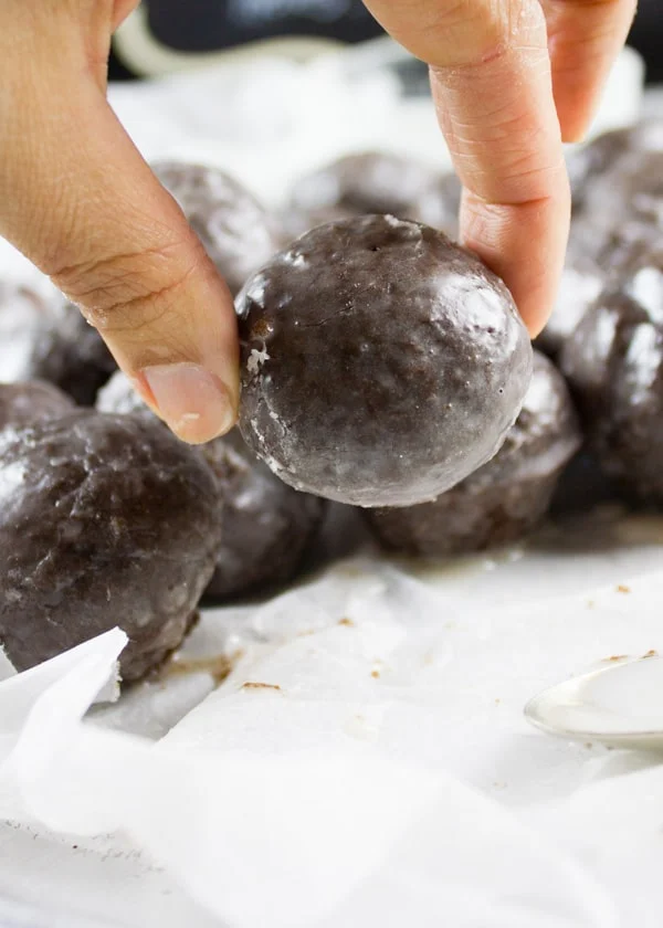 Caramel Spiked Chocolate Donut Holes. The best baked donut holes you'll ever make! tender, fluffy and intensely chocolate-y with a spike of caramel in the donut and glaze! Get the step by step recipe-foodallianceblog.com