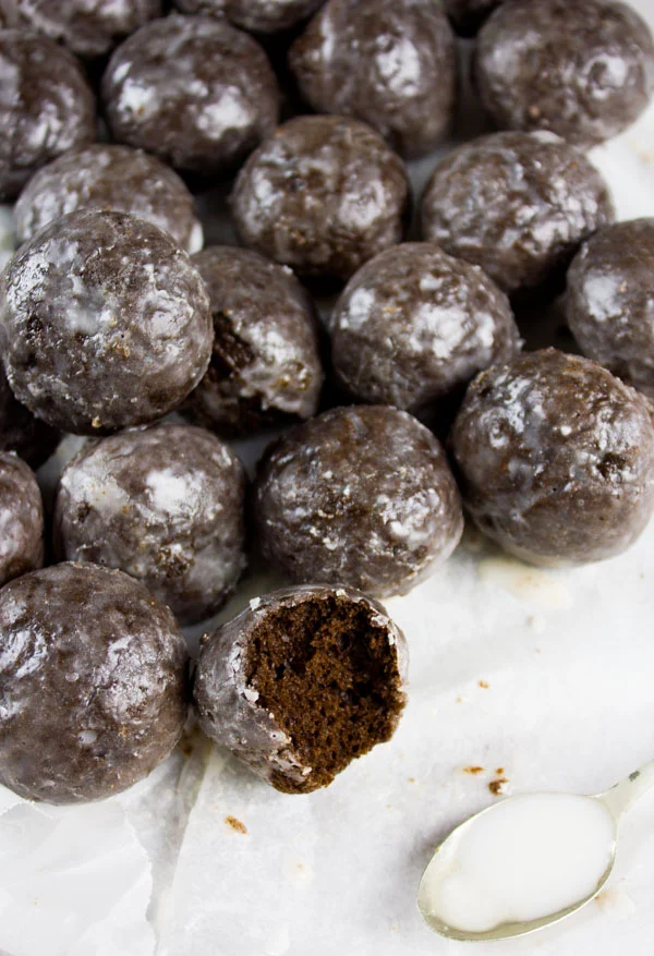 Caramel Spiked Chocolate Donut Holes. The best baked donut holes you'll ever make! tender, fluffy and intensely chocolate-y with a spike of caramel in the donut and glaze! Get the step by step recipe-foodallianceblog.com