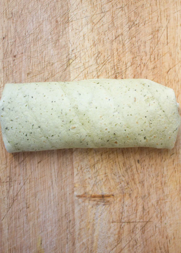 a wheat tortilla filled with Roasted chickpeas rolled into a wrap