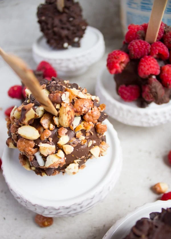 Honey roasted peanuts crusted ice cream pops close up.
