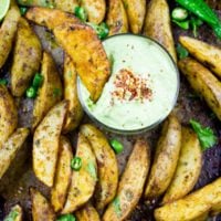 Perfect Baked Potato Wedges with Avocado Crema. Upgrade your average potatoes with these crispy spicy perfect baked potato wedges! Cool them off with a dip in the most luscious avocado sauce! Step by Step recipe at foodallianceblog.com