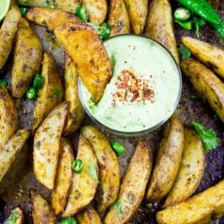 Perfect Baked Potato Wedges with Avocado Crema. Upgrade your average potatoes with these crispy spicy perfect baked potato wedges! Cool them off with a dip in the most luscious avocado sauce! Step by Step recipe at foodallianceblog.com