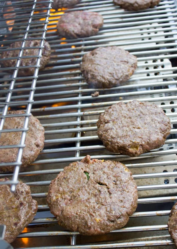 lamb burgers grilling on a bbq