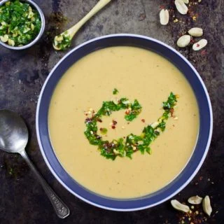 Creamy Peanut Soup with Peanut Crunch Herb Pistou. Authentic African recipe that my family picked up a long time ago, and we've been making/sharing it since then! It's pure peanut LOVE in every sip! foodallianceblog.com