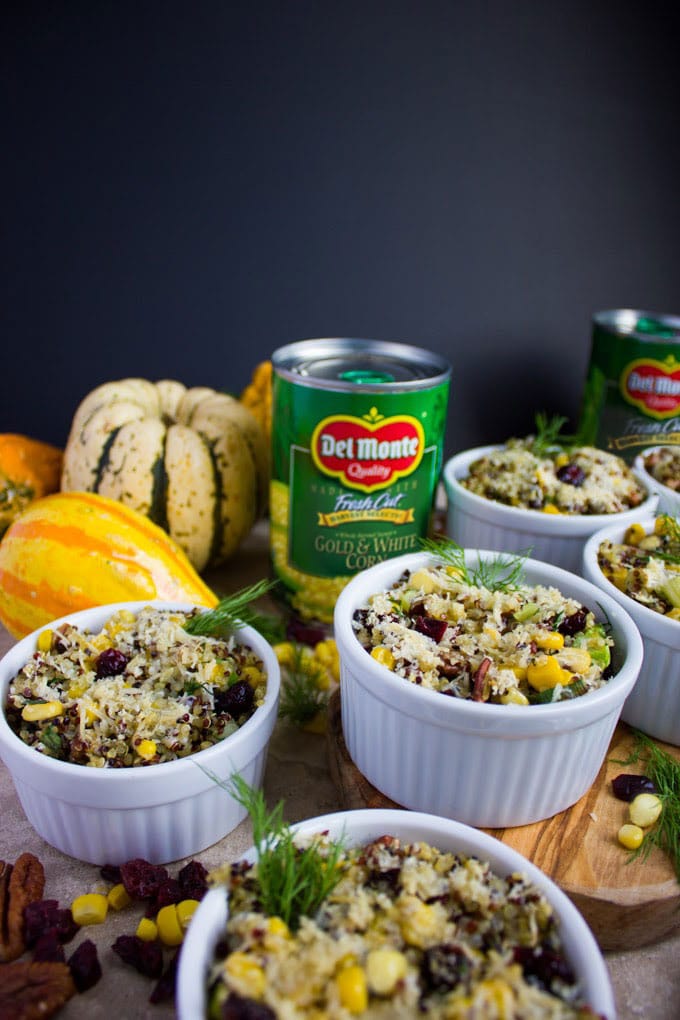 individual ramekins with quinoa stuffing arranged in front of del monte vegetable cans