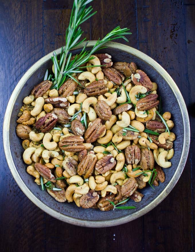 Rosemary Spiced Candied Pecans and Cashews in a small metal bowl