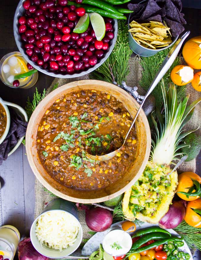 overhead shot of a big pot of vegetarian chili with a ladle