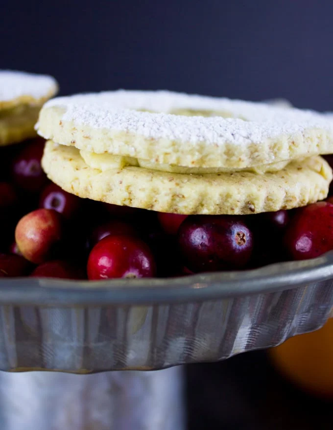 Holiday Maple Linzer Cookies. This delicious twist on a delicious cookie is the BEST! Bake a huge batch of these, they disappear fast! foodallianceblog.com