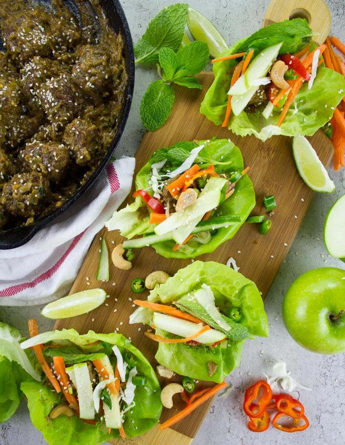 overhead shot of Thai Chicken Meatballs lettuce wraps with Apple Peanut Sauce