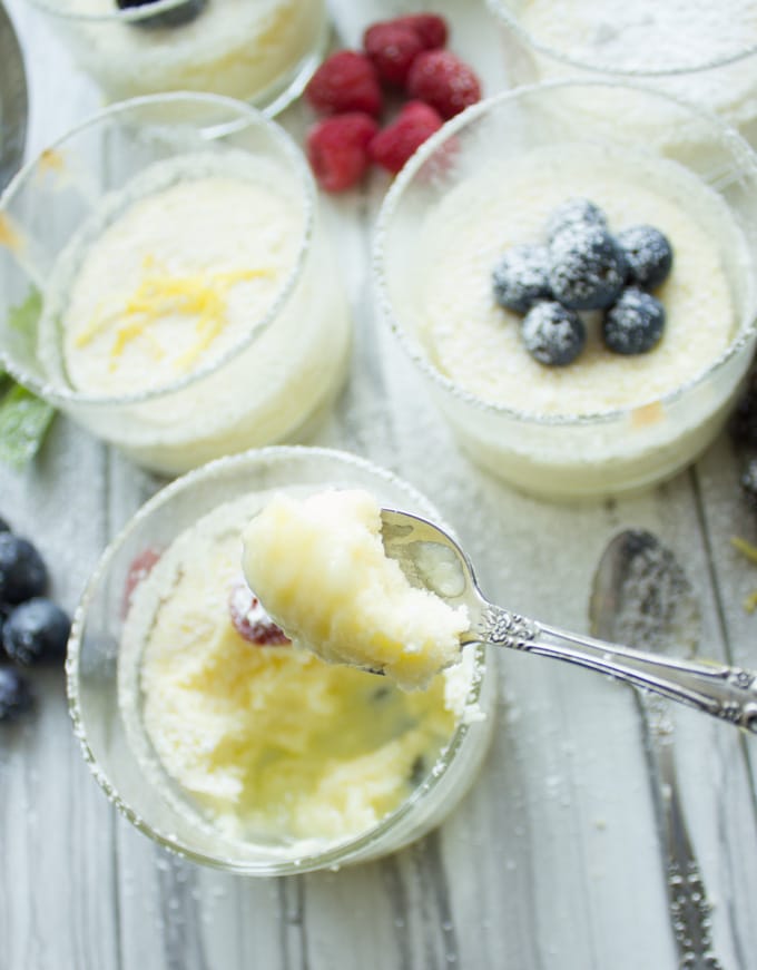 a spoon being dipped into a Mini Lemon Pudding Cake