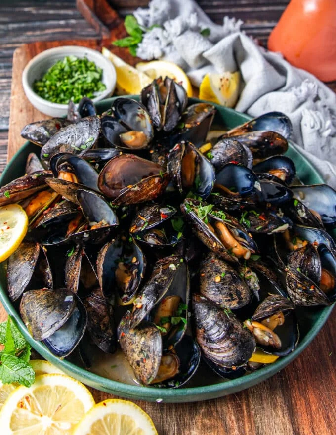 A large plate of perfectly cooked mussels
