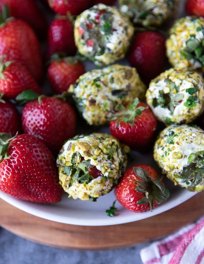 close up of a goat cheese appetizer with strawberries showing the textures