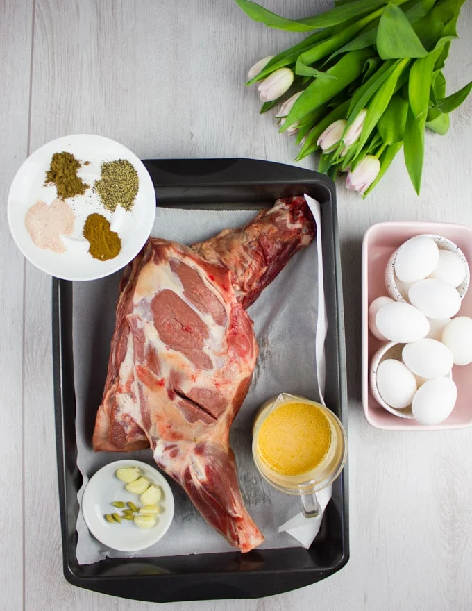 Whole Lamb shoulder and ingredients around it such as spice blend and wet ingredients