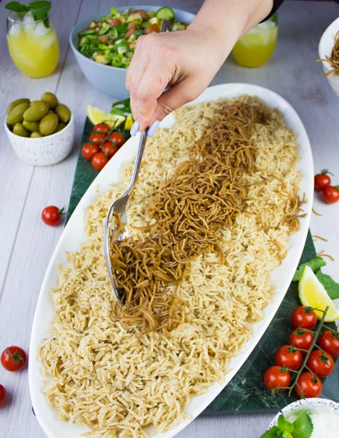 cooked vermicelli over the rice to plate the lamb shoulder recipe