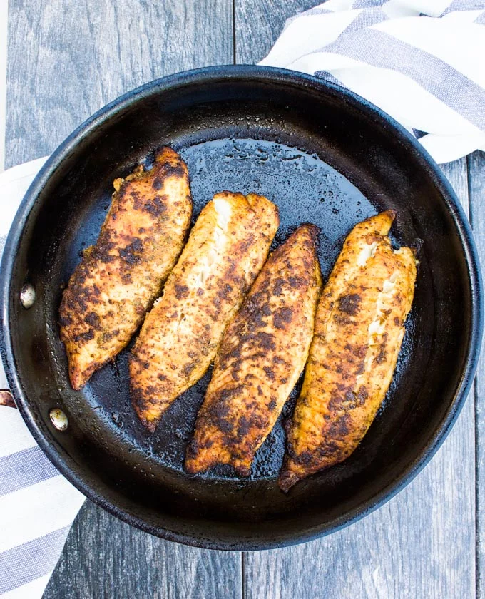 Cooked fish tacos in a pan seared till perfection