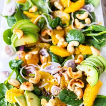 close up of an orange salad plate