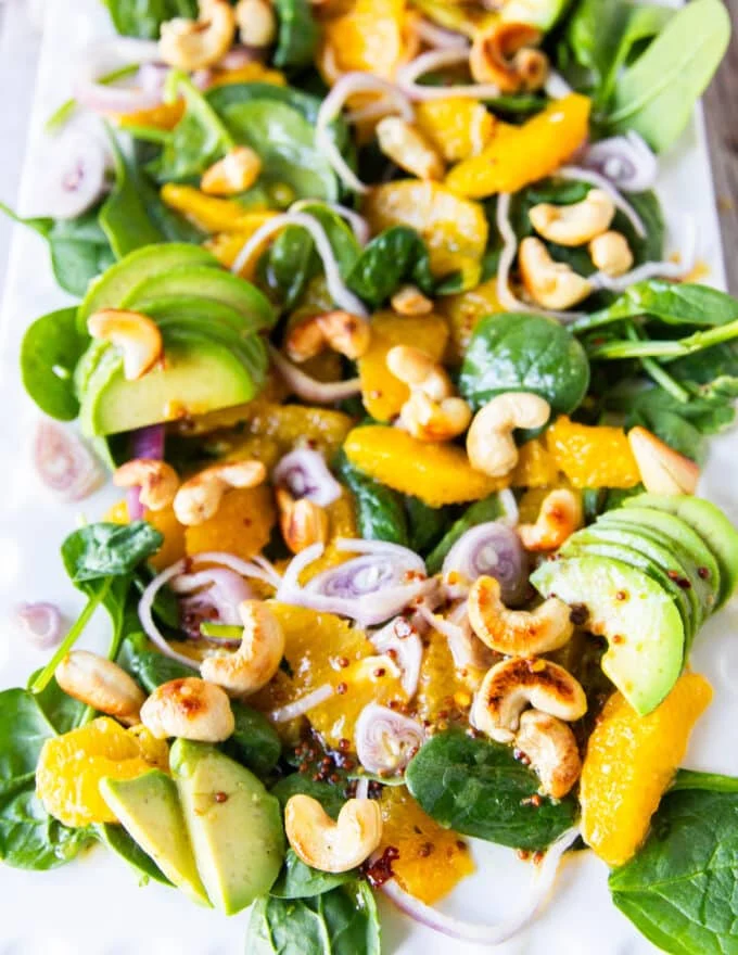 close up of an orange salad plate