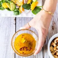 Orange dressing ingredients in a bowl